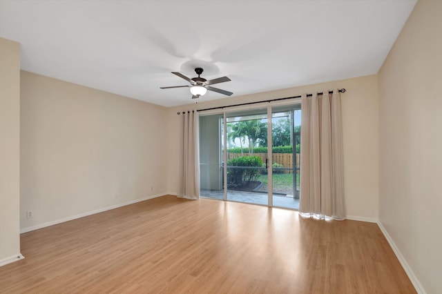 unfurnished room featuring ceiling fan and light wood-type flooring