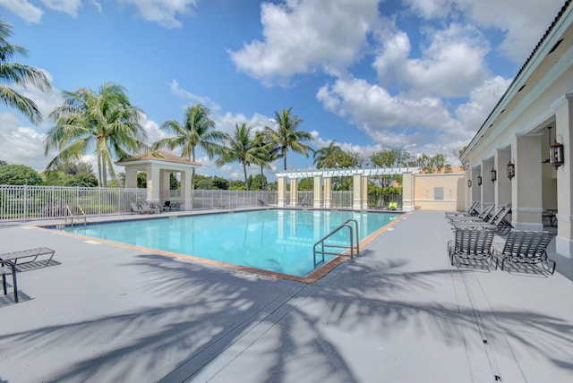 view of swimming pool featuring a pergola and a patio area