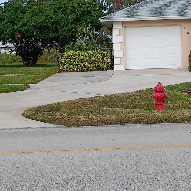 garage with a yard