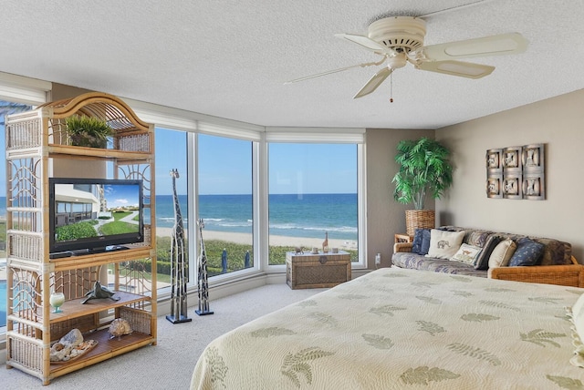 carpeted bedroom featuring a textured ceiling