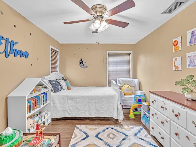 bedroom featuring ceiling fan and hardwood / wood-style flooring