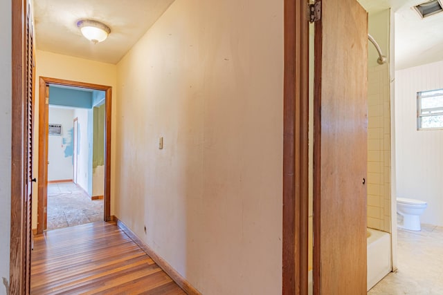 hallway featuring wood-type flooring