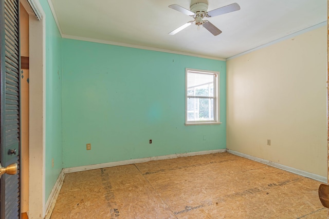 empty room with ceiling fan and ornamental molding