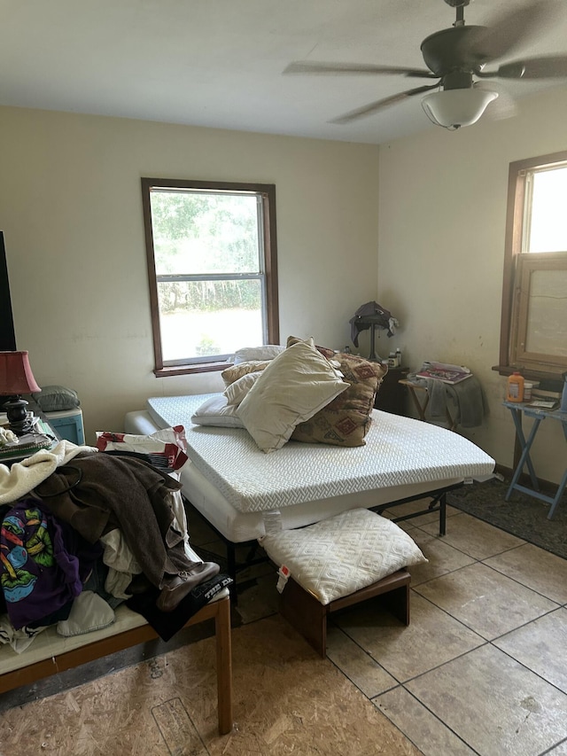 tiled bedroom with ceiling fan