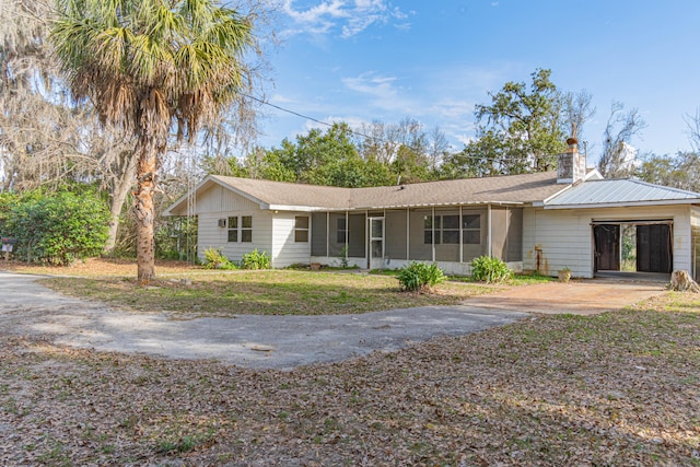 ranch-style house with a front lawn and a garage