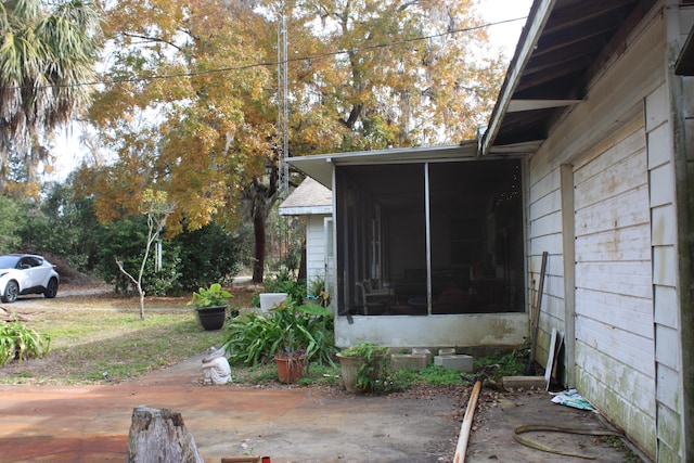 view of patio / terrace featuring a sunroom