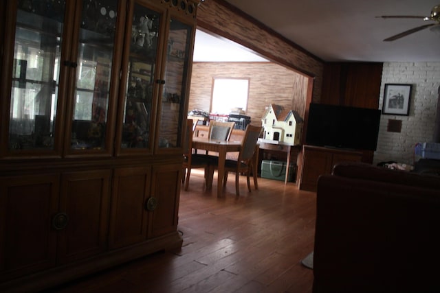 dining space featuring dark wood-type flooring and ceiling fan