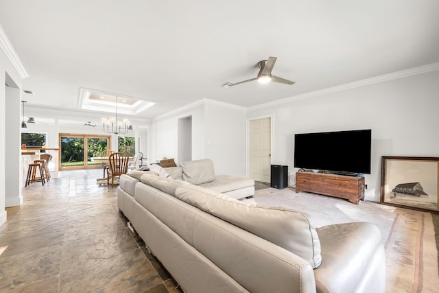 living room featuring a raised ceiling, crown molding, and ceiling fan with notable chandelier