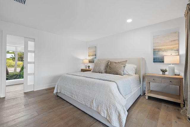 bedroom with hardwood / wood-style floors