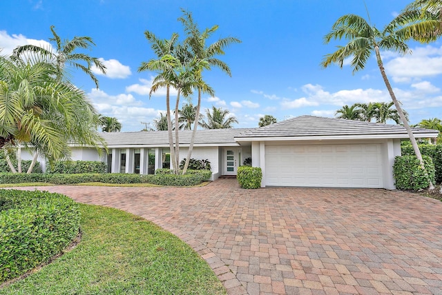 ranch-style house featuring a garage