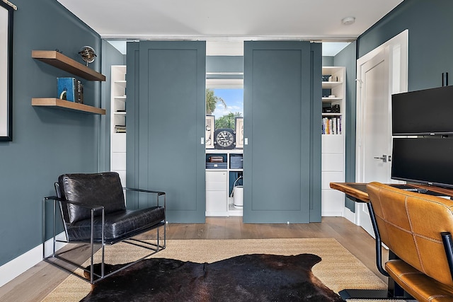 sitting room featuring light wood-type flooring