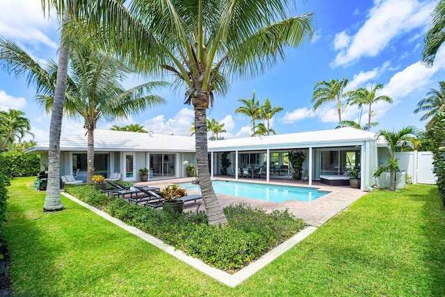 view of swimming pool with a yard and a patio