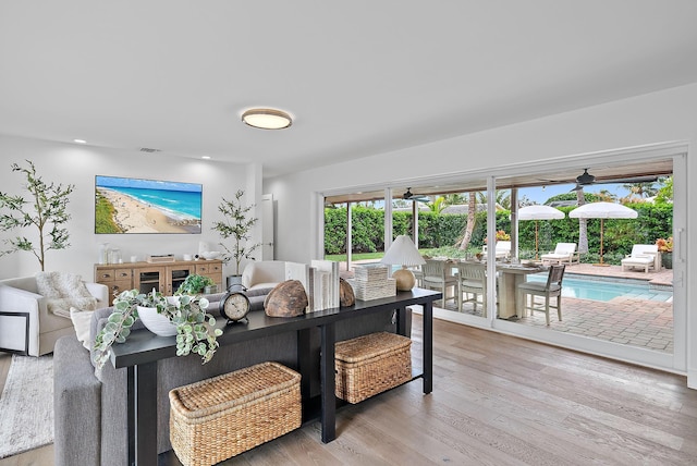 living room with light hardwood / wood-style flooring