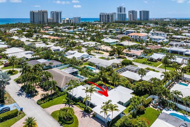 birds eye view of property featuring a water view