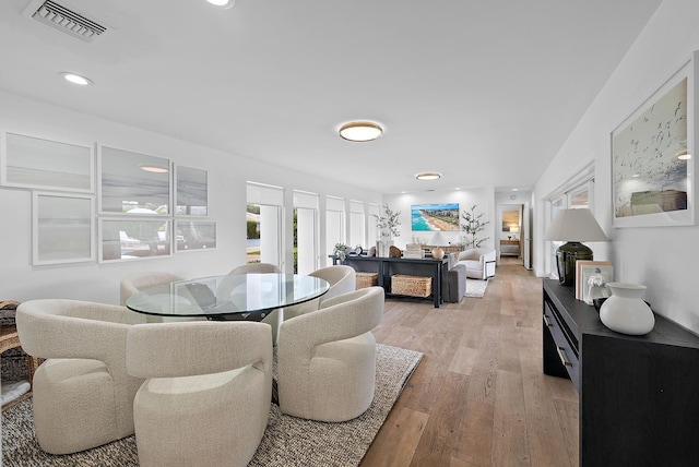 dining area with light hardwood / wood-style flooring