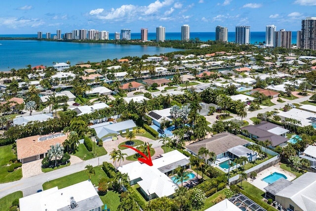 birds eye view of property featuring a water view