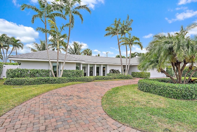 ranch-style home with a front yard