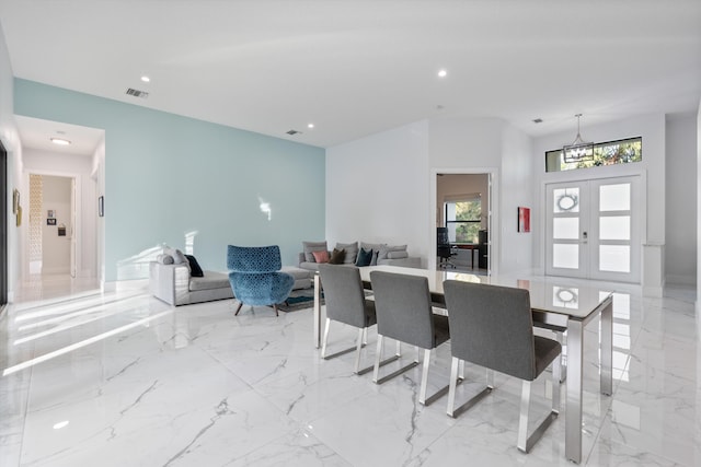 dining space featuring french doors