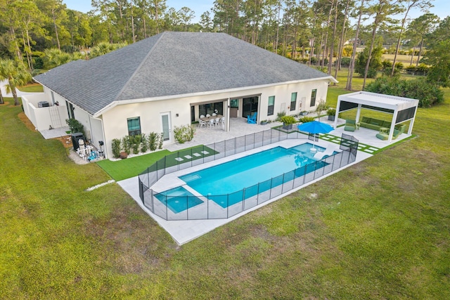 rear view of house with a gazebo, a yard, and a patio