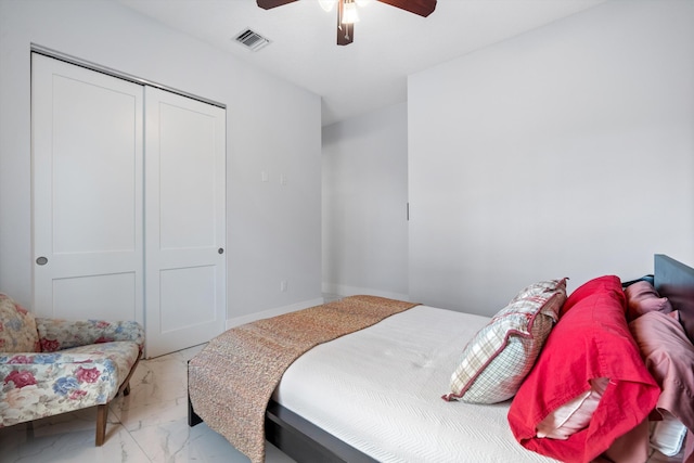 bedroom featuring ceiling fan and a closet