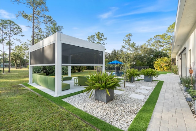 view of yard featuring a sunroom