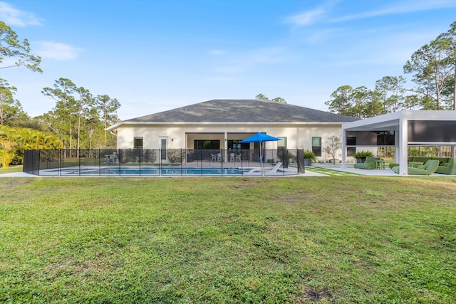 exterior space with a fenced in pool and a patio area