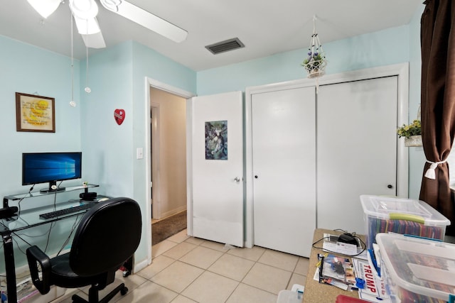 tiled office space with ceiling fan