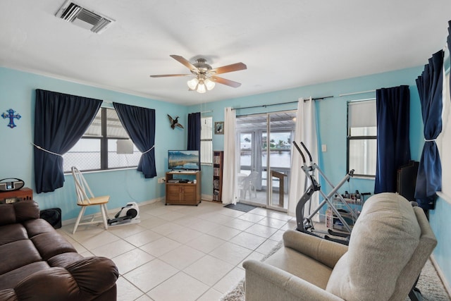 living room with ceiling fan and light tile patterned floors