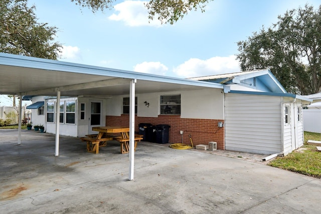 exterior space featuring a carport