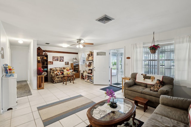 tiled living room featuring ceiling fan