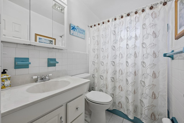 bathroom featuring vanity, tile walls, toilet, tile patterned flooring, and a shower with shower curtain