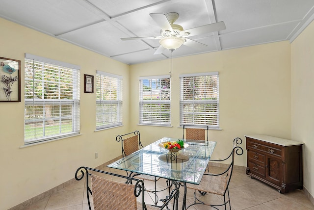 dining area featuring a ceiling fan, baseboards, and light tile patterned flooring