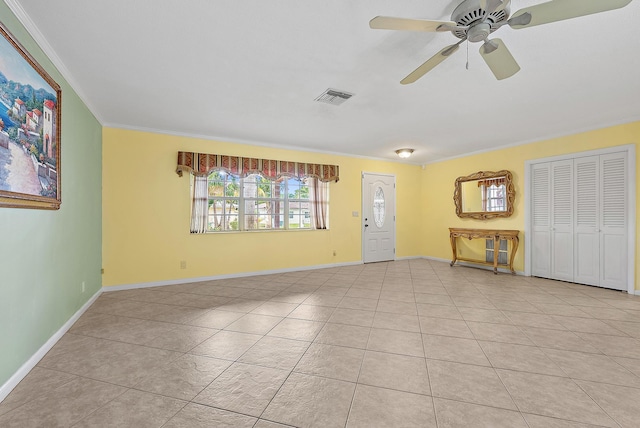 unfurnished living room with light tile patterned flooring, crown molding, and ceiling fan