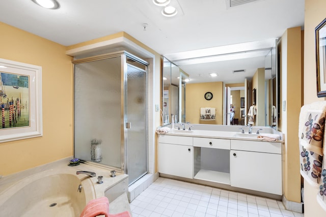 bathroom featuring vanity, tile patterned floors, and plus walk in shower