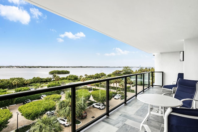 balcony featuring a water view