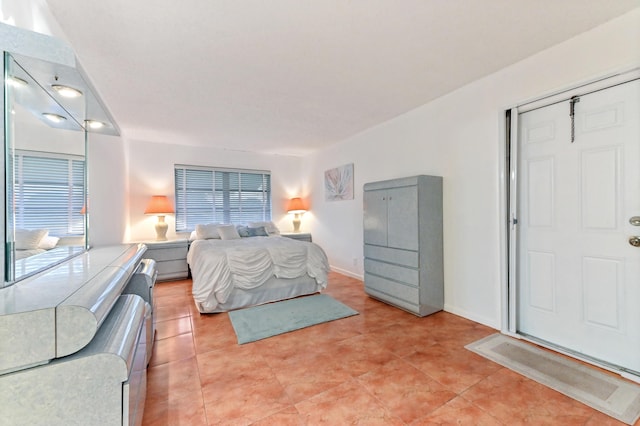 bedroom with light tile patterned floors