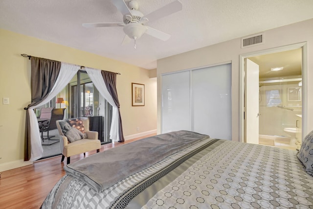 bedroom with hardwood / wood-style flooring, ceiling fan, a textured ceiling, access to outside, and a closet