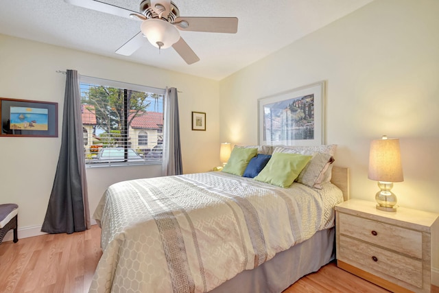 bedroom featuring ceiling fan and light wood-type flooring