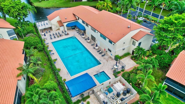 birds eye view of property featuring a water view