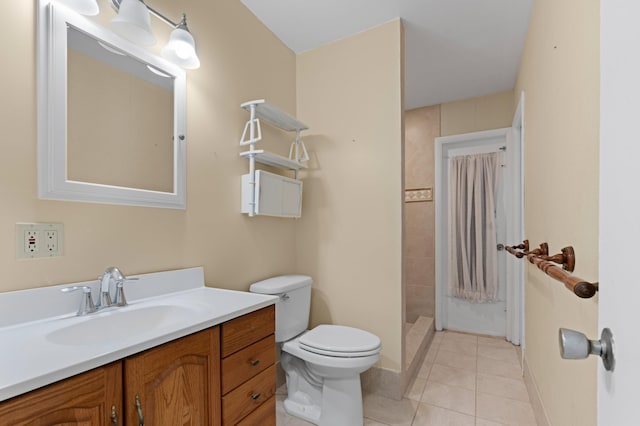 bathroom with toilet, vanity, a shower with shower curtain, and tile patterned flooring