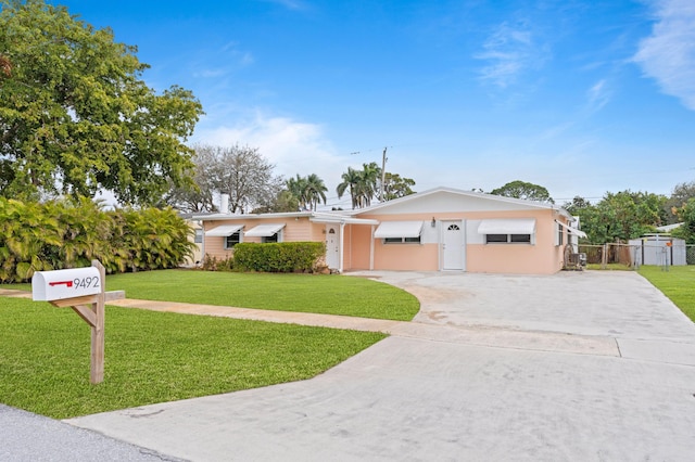 single story home featuring a front yard