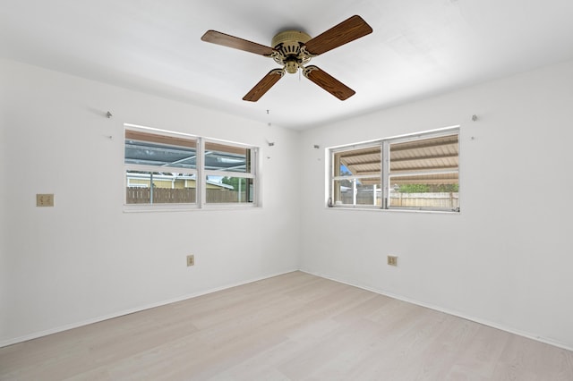 unfurnished room with light wood-type flooring and ceiling fan