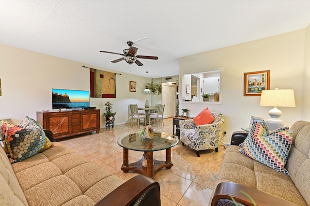 living room with light tile patterned floors and ceiling fan