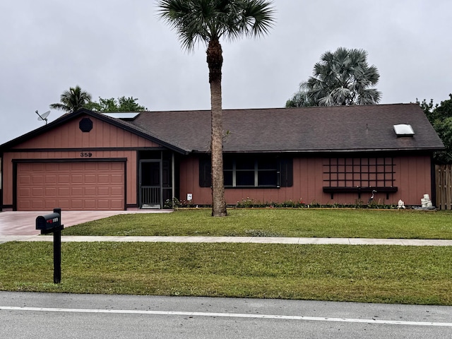 single story home featuring a garage and a front yard