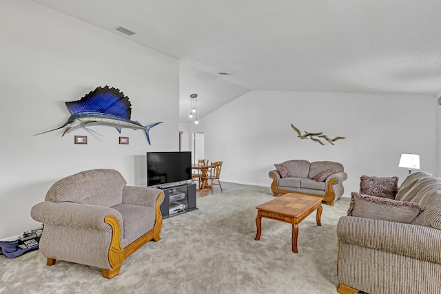 living area featuring carpet flooring, vaulted ceiling, and visible vents