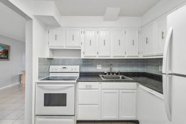 kitchen featuring light tile patterned floors, sink, white appliances, and white cabinets