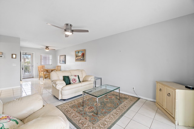 tiled living room with ceiling fan