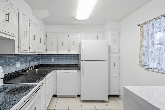 kitchen featuring white appliances, white cabinets, decorative backsplash, sink, and light tile patterned floors