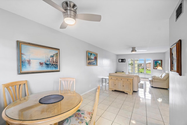 dining room with ceiling fan and light tile patterned flooring