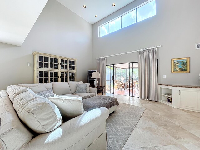 living room with a high ceiling